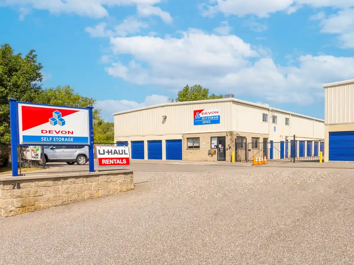 Devon Self Storage office exterior with facility signage and U-Haul rentals available on site
