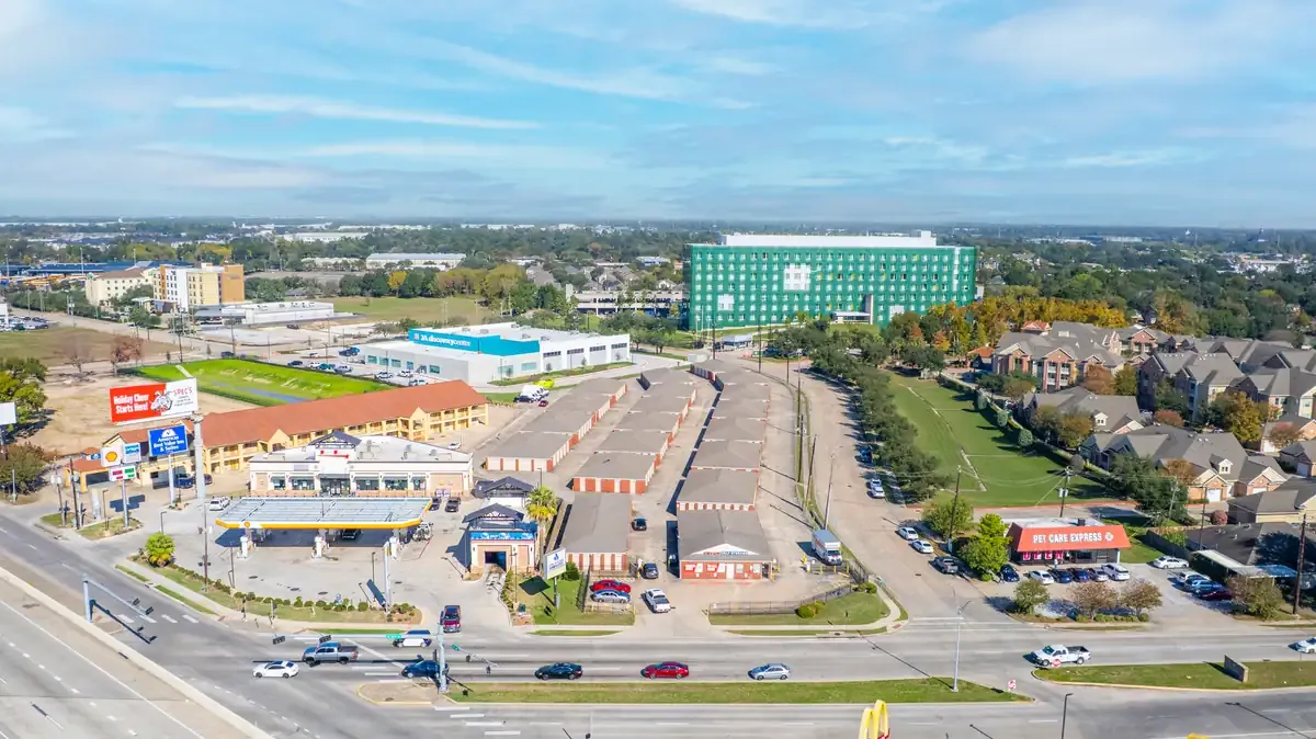 Aerial view of Devon Self Storage facility showing multiple storage buildings and surrounding commercial area