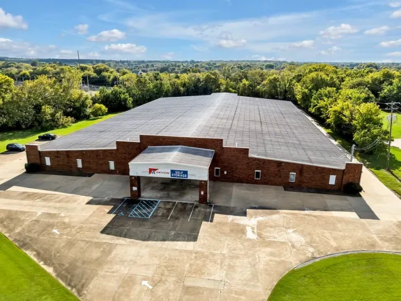 Aerial view of Devon Self Storage facility with large indoor storage building and surrounding landscape