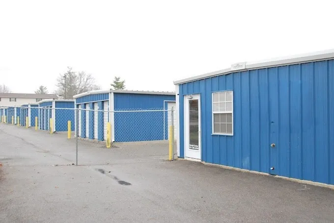 Devon Self Storage - Fort Campbell, blue building, white doors, gated, secure storage area