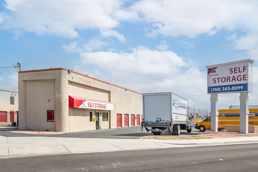 Building entrance with Devon Self storage sign and moving truck