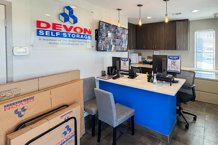 Devon Self Storage office with service counter, moving boxes, and customer seating area