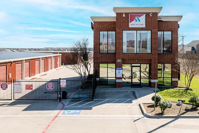 Exterior view of entrance and gated self storage at Devon Self Storage - Fort Worth on Blue Mound
