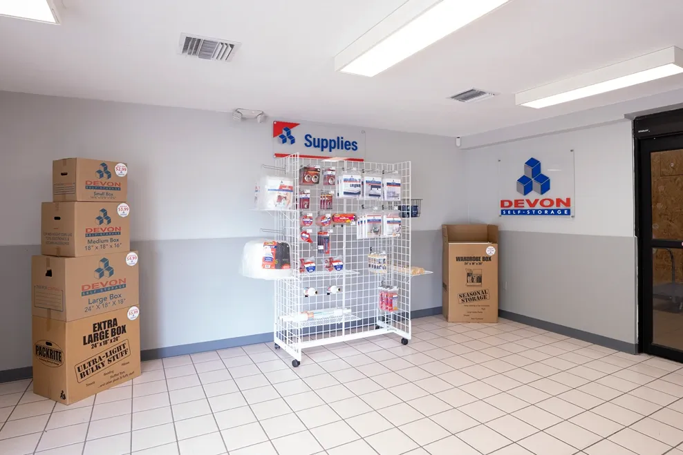 Packing supplies with Devon logo on wall