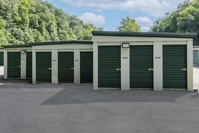 Outdoor walk up storage units Self Storage in Pittsburgh, PA, green doors to small unit sizes