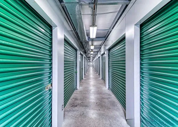 Indoor storage at Devon Self-Storage - Lake Orion, green doors