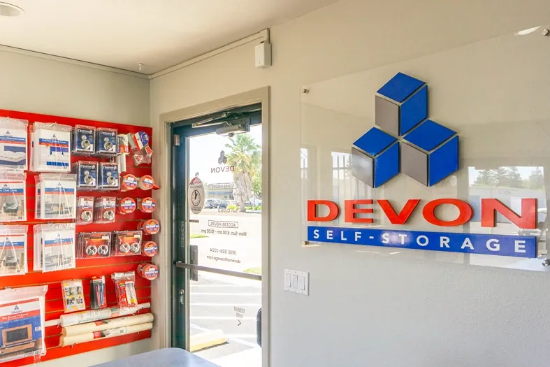 Packing supplies with Devon logo on wall