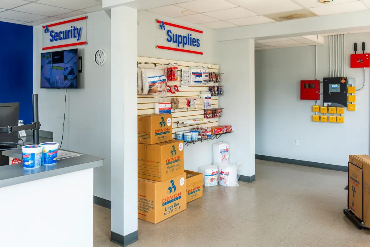 Devon Self Storage office interior featuring security monitoring and moving supplies for purchase