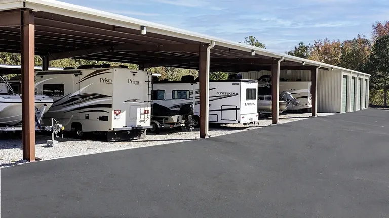 Covered vehicle storage for RVs and boats alongside drive-up storage units