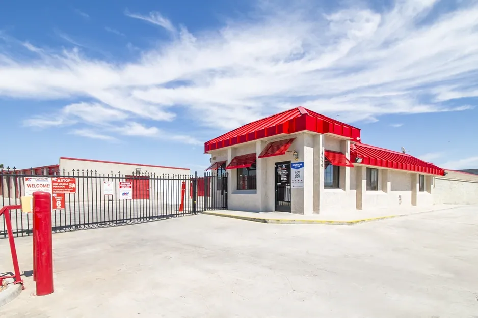 Secure, gated storage entrance to drive up storage units in West Apple Valley, CA, at Devon Self Storage - West Apple Valley