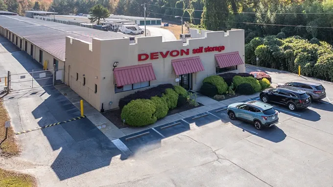 Aerial view of Devon Self Storage office building with parking and adjacent storage units